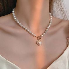 This Is A Simulated Pearl Choker Necklace. Pendant Is Heart Shaped Lined With Some Crystals. Perfect For Wedding Engagements, Formal Party And Any Other Social Gathering. Excellent Piece When In Gown Or Sunday's Best Dresses. Girly Pearl Necklace, Pearl Heart Bead Necklace, Coquette Beaded Necklaces, Pearl Bead Necklace, Heart Pendent, Big Pearl, Wedding Party Jewelry, Pendent Necklace, Jewelry Choker