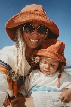 Hello, sun! It's time to embrace the sunny days with Blue Corduroy's Rust Wide Brim Sun Hat. Not only does it add a pop of color to your outfit, it also protects your scalp from the sun's harshness. The wide brim offers a cool, stylish look, and its corduroy texture adds an interesting twist to a typical sun hat. Get ready to be the trendiest at the beach, on a picnic, or just lounging under the trees. Don't let the sun get in the way of your fun, shop now! Newborn Sun Hat, Toddler Bucket Hat, Custom Fitted Hats, Toddler Beach, Corduroy Hat, Bucket Hat Women, Matching Mom, Baby Sun Hat, Wide Brim Sun Hat