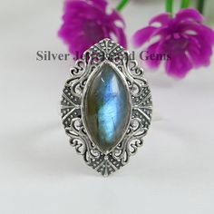 Gemstone-Labradorite Shape-Marquise Stone Size - 9x18 MM Metal-925 Sterling Silver This One of a kind ring is adorned with beautiful Labradorite with blue sheen Gemstone in sterling silver band. About gemstone-Labradorite gemstone is quite beautiful with a lovely energy that makes them a delight to surface use. Labradorite brings energy of synchronicity into your life. Labradorite is the stone of magic as it allows innate magical powers and brings out the best in people making world life more co Bohemian Style Cabochon Crystal Ring For Anniversary, Bohemian Stackable Gemstone Rings Oval Shape, Bohemian Gemstone Wedding Rings, Bohemian Wedding Crystal Ring With Cabochon, Bohemian Wedding Rings With Cabochon, Bohemian Wedding Ring With Cabochon, Bohemian Silver Stackable Rings With Gemstone, Bohemian Crystal Cabochon Ring For Anniversary, Bohemian Cabochon Crystal Ring For Anniversary