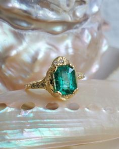 * guided by love* _________ ONE OF A KIND Can be sized from 4 - 8. Please put your desired size in notes section 18k Yellow Gold Set w/ 1.43ct Columbian Emerald approx 7.81 x 5.85 x 4.44mm (6) 1.1mm White Diamonds Accent stones on (3) on each side of diamonds & (3) 1.1mm on top of Emerald *Emeralds *The presence of inclusion and imperfections are natural and add to their character, which so many people are drawn to. Luxury Diamond Ring With Emerald Accent Stones, Heirloom Emerald Ring With Diamonds For Promise, Heirloom Style Diamond Emerald Promise Ring, Heirloom Diamond Emerald Promise Ring, Luxury Emerald Rings With Accent Stones, Luxury Emerald Ring With Accent Stones, Timeless Emerald Ring With Accent Stones As Gift, Luxury Emerald Jewelry With Accent Stones, Luxury Emerald Ring With Diamond For Promise