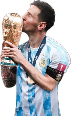 a soccer player kissing the world cup