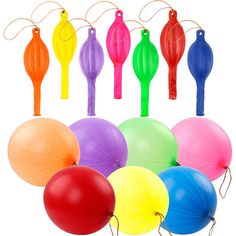 many different colored balloons are arranged in a circle on a white background with string attached to each balloon