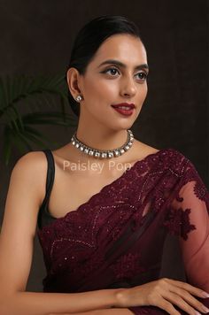 The Polki choker necklace is inspired by the rich Indian jewelry-making techniques handcrafted by the artisans to celebrate perfect armor between ancient and modern concepts. The gold plated western necklace can be paired with your Indo western dresses gracefully. Pair this gorgeous replica of Bollywood jewelry with your ethnic or contemporary ensembles and create a look to remember. Necklace Closure - Adjustable Dhori. Style Tip - The tasteful design will keep you hooked every time you look at Festive Bridal Choker Necklace For Formal Occasions, Elegant Festive Choker, Festive Formal Bridal Choker Necklace, Elegant Kundan Necklace With Cutdana For Party, Elegant Party Kundan Necklace With Cutdana, Heavy Choker Necklace For Party, Elegant Cutdana Choker For Festivals, Heavy Choker For Party And Festivals, Elegant Heavy Choker For Party