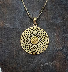 HANDMADE Stunning statement Star Mandala, sacred geometry pendant with a complementary chain. Made by hand with hight quality of brass, Nickel free.  SIZE Aprox pendant height: 5 cm Aprox Pendant Width: 3.7 cm LINK Don't miss the rest of the collection, please follow the link.  https://www.etsy.com/uk/shop/JagathaStudio Brass Amulet Medallion Necklace With Round Pendant, Brass Round Pendant Amulet Medallion Necklace, Symbolic Brass Medallion Necklace, Brass Amulet Jewelry With Round Pendant, Brass Amulet Jewelry For Meditation, Brass Amulet Medallion Necklace As Gift, Brass Round Jewelry For Meditation, Nickel Free Brass Medallion Necklace With Round Pendant, Round Brass Jewelry For Meditation