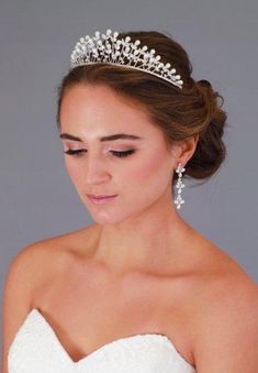 Regal Cubic Zirconia and Pearl Wedding Tiara Bridal Crown Perfect for a regal princess gown, this wedding crown for brides is the ideal fairy tale wedding headpiece. This pearl bridal tiara gleams with Genuine Cubic Zirconia gems. Adorned by an elegant array of pearls, this crown headpiece is fit for a royal wedding. The design of the crown measures 9" around the silver rhodium band and stands 1 3/4" at the highest. Includes loops at each end to secure with hair pins. Hair Accessories Tiara, Crown Headpiece, Tiara Bridal, Pearl Tiara, Beautiful Hair Accessories, Belly Jewelry, Princess Gown, Wedding Hair Inspiration, Pearl Bridal