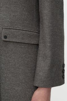 Expertly crafted from luxurious Italian bouclé fabric, this high-quality wool blend coat from CLOSED is the perfect addition to your transitional season wardrobe. With a double-breasted design, lapel collar, and horn-look buttons, this coat exudes sophistication and style. Other features include flap pockets, smooth lining, and a buttoned inside pocket for added functionality. Manufactured by our trusted partner Texdata in Romania. Business Long Coat Single Breasted Tweed Jacket, Business Long Coat Style Single Breasted Tweed Jacket, Wool Double-breasted Outerwear For Semi-formal Occasions, Winter Tweed Jacket For Office With Concealed Placket, Winter Office Tweed Jacket With Concealed Placket, Designer Outerwear With Double Button Closure And Suit Collar, Tailored Tweed Jacket With Hidden Buttons For Winter, Winter Notch Lapel Blazer With Double Button Closure, Office Wool Tweed Jacket With Double-breasted Buttons