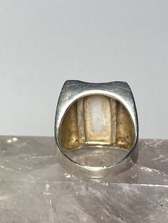 "Mother of Pearl ring marcasites sterling silver women Size. 8.75 Weight 11g Length. 7/8\" Width 5/8\" Narrowest part of band 3/16\" Free Shipping & Free Postal Insurance Delivered in a Gift Box If you do not want the ring polished and want to leave the natural patina please let me know at the time of purchase as I do polish rings before I ship rings out. Thanks Free First Class shipping and postal insurance is included. If you want to upgrade to priority kindly pay an additional fee to do s Vintage Silver Moonstone Ring With Polished Finish, Vintage Silver Opal Promise Ring, Antique Silver Opal Ring, Antique Silver Opal Ring For Formal Occasions, Vintage Silver Signet Ring With Gemstone, Vintage Sterling Silver Opal Ring With Silver Color, Silver Marcasite Ring, Antique Silver Opal Ring For Anniversary, Vintage Silver Hallmarked Moonstone Ring