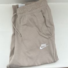 Beige Nike Joggers Nike Beige Cotton Bottoms, Beige Nike Cotton Bottoms, Nike Casual Beige Bottoms, Sporty Neutral Bottoms For Spring, Jordan Woman, Beige Nike, Nike Joggers, Tan Pants, Jordans Women