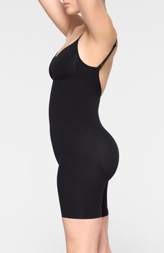 Sculpt your natural shape with a mid-thigh bodysuit that holds in your core, lifts your butt and supports your chest flawlessly even in backless outfits. V-neck Adjustable straps 82% nylon, 18% spandex Machine wash, line dry Made in Turkey Black Sleek Shapewear With Built-in Bra, High Stretch Shapewear Bodysuit With Built-in Bra, High Stretch Smoothing Sleeveless Shapewear, Sleeveless High Stretch Smoothing Shapewear, Sleek Shaping Shapewear With Seamless Construction, Sleek Shapewear With Seamless Construction, Sleek Black Shapewear With Built-in Bra, Black High Stretch Smoothing Bodysuit, Solid Backless Shaping Shapewear