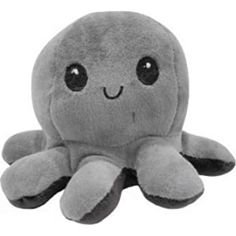 an octopus stuffed animal sitting on top of a white surface