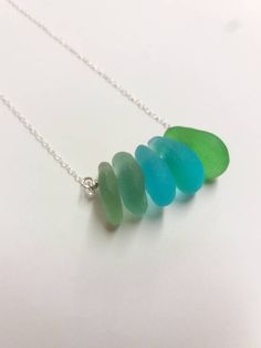 An Irish sea glass necklace made with small sea glass found on the beautiful Wild Atlantic Way of Ireland. This necklace makes a unique gift for a beach lover or someone special in your life. Comes on a sterling silver chain. If you prefer another colour, please indicate the colour in the notes to seller at check out. Comes in an elegant gift box ready as a gift. If you need a bigger quantity or any customized jewellery for your very special occasion (birthdays, weddings, bridal showers or any o Turquoise Sea Glass Necklace For Beach, Handmade Ocean-inspired Sea Glass Necklaces, Ocean-inspired Sea Glass Necklaces For Beach, Ocean-inspired Green Necklaces For Beach, Green Ocean-inspired Necklaces For The Beach, Green Ocean-inspired Necklaces For Beach, Green Ocean-inspired Beach Necklaces, Green Sea Glass Necklaces For Jewelry Making, Green Sea Glass Necklace For Jewelry Making