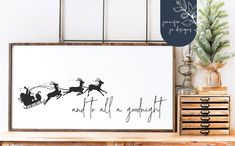 a christmas card with santa sleigh and reindeers on the back in black ink