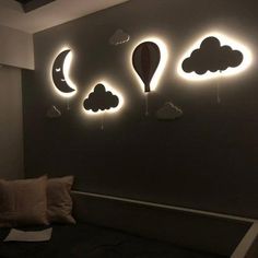 a bed with some lights on the wall above it