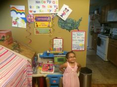 Amya modeling her homeschool area next to her playhouse, which is conveniently closed off for play during school hours by simply folding down the sheet and using binder clips to keep it tightly closed! No temptation, no time wasting! Homeschool Area, Binder Clips, Working With Children, No Time