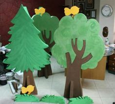 paper cut out trees in the middle of a room