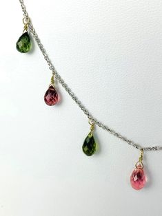 Multicolored tourmaline 11 station dangly necklace. Necklace contains 11pcs of 3.5x6mm-5.5x9mm mixed pink, green, and blue tourmaline faceted pear drops hanging in stations from a 16" long 18k white gold chain. Metal - 18k White Gold Gemstones - Tourmaline Length - 16" Dangly Necklace, White Gold Chain, Blue Tourmaline, Necklace Necklace, Green And Blue, Gold Chain, Tourmaline, Pear, White Gold