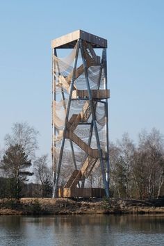 a tall metal structure sitting on top of a lake