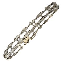 18 Karat White Gold and Diamond Bracelet- This sparkling bracelet features 100 round brilliant cut diamonds set in beautifully detailed 18K white gold. Width: 7 mm. Approximate total diamond weight: .50 ct. Diamond color: H-I Diamond clarity: SI1-I1 Size: 6.75 inches Weight: 8.2 dwt. / 12.8 gr. Stamped: 18K 750 Very good condition, professionally polished. Will come packaged in a gift box or pouch (when possible) and will be shipped U.S. Priority Mail Insured. DV062722/17KCS Luxury Vintage Diamond Bracelet For Gift, Gold And Diamond Bracelet, White Gold Diamond Bracelet, Sparkle Bracelet, Bracelets Gold Diamond, Diamond Color, Round Brilliant Cut Diamond, Diamond Clarity, Brilliant Cut Diamond