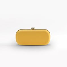 The Limoncello Yellow Bella Clutch is a bold yellow bridal handbag, crafted with duchess satin by Italian artisans featuring a lively pop of color. Planning a maximalist wedding day or looking to make a powerful statement at your next gala? Inspired by Italy’s Amalfi Coast, a coastline featuring terraced vineyards and cliffside lemon groves, this luxury handbag will make a statement on your wedding day, at a red-carpet affair, or on a tropical destination trip. First seen on celebrity stylist Mi Chic Yellow Clutch For Gift, Chic Yellow Clutch For Formal Occasions, Chic Yellow Clutch As Gift, Chic Yellow Clutch As A Gift, Elegant Yellow Bags For Formal Occasions, Elegant Yellow Bag For Formal Occasions, Elegant Yellow Formal Bags, Elegant Yellow Formal Bag, Yellow Elegant Clutch For Formal Occasions