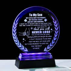 a blue glass award with a poem on it