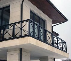 an apartment building with balcony and balconies