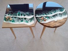 two side tables with seashells painted on them