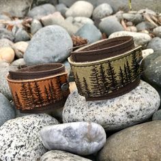 "I've made this wrapping cuff out of soft, smooth olive taupe and choose from brown or black base leather. The leather has been hand printed with an image using indelible (permanent) ink. Machine stitched, it has an attached elastic that hooks over a button, so this cuff will adjust to fit most wrist sizes 5.75\" to 7\" in circumference. At the narrowest, the width of the cuff is 1.25\" and at the widest it's 2\". Only premium quality leather and supplies are used to handcraft each item. Small i Shiney Things, Leather Jewelry Diy, Diy Slippers, Leather Jewellery, Leather Cuff Bracelet, Leather Wristbands, Hand Painted Jewelry, Leather Crafts, Customized Jewelry