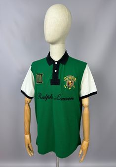 Vintage Polo Ralph Lauren Snow Polo Challenge Polo Shirt Size XL Custom Fit 90s Excellent used condition, without any rips/stains/ etc. PLEASE CHECK MEASUREMENTS!! pit2 pit: 23'6" inches \ 60 cm length on the back: 30'7" inches \ 78 cm shoulders: 19'2" inches \ 49 cm If u have any questions please contact me before purchase Green Collared T-shirt For Streetwear, Green Polo Collar Top For Streetwear, Green Cotton Polo Shirt For Streetwear, Retro Green Short Sleeve Polo Shirt, Green Short Sleeve Polo Shirt For Streetwear, Green Polo Shirt With Graphic Print, Green Cotton Polo Shirt With Graphic Print, Green Polo Collar Shirt With Graphic Print, Vintage Green Short Sleeve Polo Shirt