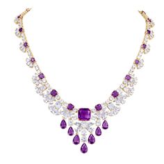 This charming collection is perfect for a special occasion. A cascade of ice white and vivid violet shimmer across your neckline and sparkle from your earlobe. Just over 80 carats of these delightful gems in classic cushion, pear and round cuts are handset into this piece. Finished in luxurious 18k yellow gold, adds the final touch to this superb collection. Luxury Yellow Gold Round Bridal Necklace, Luxury Purple Diamond Cut Necklace, Luxury Purple Diamond Necklace, Purple Prong Setting Formal Necklaces, Dazzling Cushion-cut White Jewelry, Luxury Purple Teardrop Jewelry, Luxury Purple Jewelry For Wedding, Luxury Purple Drop Jewelry, Elegant Purple Jewelry With Diamond Accents