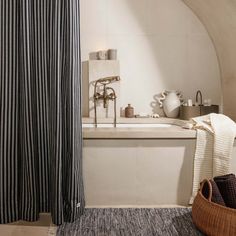 a bath room with a tub and a shower curtain