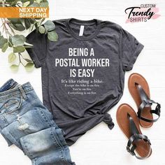 a t - shirt that says being a postal worker is easy