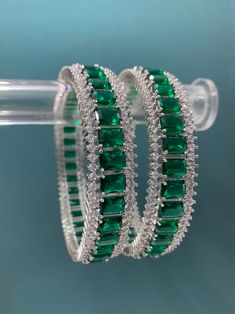 American diamond bangle/bracelet in Victorian polish. About one inch thick. Openable style, black polish (Victorian) and colored stone work Green Diamond Bracelet, American Diamond Bracelet, Green Bracelet Aesthetic, Emerald Diamond Bangles, Real Diamond Bangles Designs, Diamond Kada Bangles, Green Stone Bangles, Bangle Models, Diamond Bangles Indian