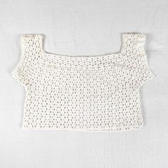 Really beautiful handmade, one of a kind, fine crochet lace crop top. 100% cotton. Straight or square neckline, the sleeves sit slightly off the shoulder. It might fit more like a bra depending on your bust size. Excellent condition- barely noticeable discoloration in some areas. Its difficult to date this piece but I would guess 1960's or earlier. I consider this an item that would be nice to work into a bridal outfit, as it has a delicate romantic vibe. Please don't hesitate to ask if you have Cropped Lace Crochet Top, Fitted Cotton Crochet Lace Crop Top, Cropped Crochet Lace Top, Fitted Cotton Crochet Top With Crochet Lace, Fitted Cotton Crochet Top With Lace, Fitted Cotton Crochet Top With Lace Details, Fitted Cotton Crochet Lace Top, White Crochet Lace Crop Top, White Cropped Crop Top With Crochet Lace