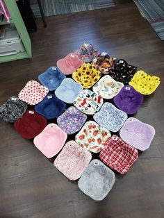 a pile of hats sitting on top of a wooden floor