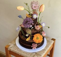 a large chocolate cake with flowers on top