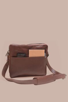 Carry your laptop in style & protection with our Leather Laptop Satchel in gorgeous brown leather. This sleek & durable satchel is specifically designed to fit a 13" laptop, ensuring your device stays safe while on the go. Lined in cotton with a YKK antique brass zipper closure Stay organized with two exterior pockets - one slip pocket with a magnetic closure on one side & a zippered pocket on the other to keep everything securely in easy reach Interior laptop divider & leather slip pocket Dimen Casual Brown Rectangular Laptop Bag, Everyday Brown Laptop Backpack, Brown Business Bag With Laptop Sleeve, Laptop Bag With Sleeve For Daily Use, Standard Backpack, Casual Leather Rectangular Briefcase, Laptop Backpack With Laptop Sleeve For Daily Use, Daily Use Laptop Bag With Laptop Sleeve, Brown Satchel Laptop Bag For Daily Use, Casual Laptop Bag With Sleeve In Satchel Shape