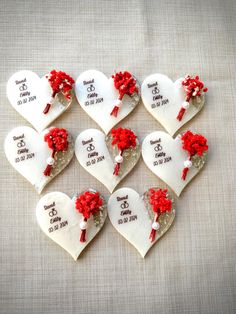 six hearts with red flowers on them are arranged in the shape of a wedding date