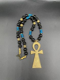 Ankh brass centerpiece with 14mm Onyx and 10mm Apatite  gemstones, accented with Ashanti brass beads.   Length: 25 inches For special deals, updates and promotions  Follow/Favorite Simone's Boutique on Etsy and instagram https://www.instagram.com/sbafrojewelz/ Ankh Necklace, Necklace African, Cow Bones, Necklace Mens, African Necklace, African Trade Beads, Ethnic Necklaces, Brass Beads, Special Deals