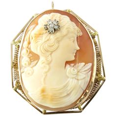 Vintage 14 Karat Yellow Gold and Diamond Cameo Brooch/Pendant- This stunning cameo features a lovely lady in profile adorned with five single cut diamonds and one rose cut diamond in her hair. Framed in delicate 14K yellow gold filigree. Can be worn as a brooch or a pendant. Approximate total diamond weight: .12 ct. Diamond color: J Diamond clarity: I1 Size: 47 mm x 42 mm Weight: 10.1 dwt. / 15.8 gr. Hallmark: 14K Very good condition, professionally polished. Will come packaged in a gift box and will be shipped U.S. Priority Mail Insured. Antique Cameo Jewelry, Cameo Jewelry, Vintage Cameo, Antique Brooches, Art Nouveau Jewelry, Carved Shell, Cameo Brooch, Cameo Pendant, Vintage Brooches