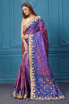 Look royal at weddings and festive occasions in this alluring purple embroidered Patola silk saree, It comes with a matching blouse piece. Disclaimer: The shown stitched blouse on the model is for display purpose only. The saree comes with a matching blouse piece and finished with fall and piko. Bollywood Style Purple Art Silk Pre-draped Saree, Purple Paithani Silk Pre-draped Saree For Wedding, Traditional Purple Pre-draped Saree, Purple Katan Silk Pre-draped Saree With Zari Work, Purple Pre-draped Saree With Traditional Pallu, Festive Purple Pre-draped Saree With Pallu, Festive Purple Tussar Silk Pre-draped Saree, Purple Dola Silk Pre-draped Saree, Traditional Purple Paithani Silk Pre-draped Saree