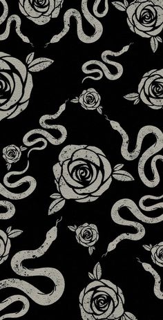 a black and white snake and rose pattern with swirls in the center, on a dark background