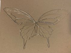 a drawing of a butterfly on a piece of paper