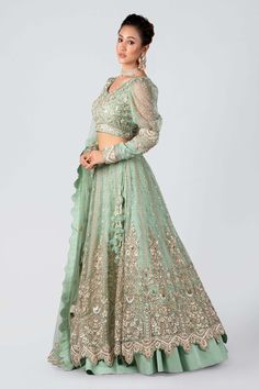 Sea green floral embroidered lehenga with zardozi and resham work. Comes with embroidered padded blouse and dupatta.
Component: 3
Pattern: Embroidery
Type Of Work: Zardozi, Resham
Neckline: V Neck
Sleeve Type: Sheer puff sleeves
Fabric: Organza,Satin
Color: Green
Other Details: 
Fully lined
Cutwork hemline
Attached lining
Dupatta with buttis and border
Occasion: Bride - Aza Fashions Green Bridal Lehenga, Embroidered Bridal Lehenga, Western Gown, Indo Western Gown, Set Saree, Casual Wear Dress, Embroidered Border, Green Hand, Sharara Set