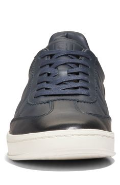 This soccer-inspired sneaker is lightweight and flexible with an anatomical sockliner and padding in the heel for exceptional fit and comfort. Lace-up style Cushioned EVA footbed with arch support Leather upper, textile lining & rubber sole Imported Navy Leather Sporty Sneakers, Sporty Navy Leather Sneakers, Modern Navy Sneakers With Round Toe, Navy Leather High-top Sneakers With Branded Insole, Leather Slip-on Running Sneakers, Comfortable Navy Sneakers With Rubber Sole, Leather Sneakers With Rubber Sole For Running, Leather Low-top Athleisure Walking Shoes, Navy Low-top Sneakers With Textured Sole