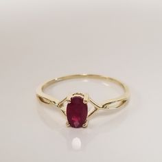 Thanks for shopping our vintage estate store. We tend to sell well below wholesale and truly hope you enjoy all of our items. Many of the items are one of a kind, so please enjoy scrolling through the pictures and hopefully something will catch your eye. Estate 10k yellow gold natural red 1/2ct ruby birthstone or graduation ring. It's sweet. Just stunning ring. Gem is a little darker on the finger, beautiful ruby. Ring size: 7 Setting: 6mm 1/4" by 4mm Band width: 1mm Weight: 1.07 grams Carat: 1/ Classic 14k Gold Ruby Ring For Valentine's Day, Classic Valentine's Day Ruby Ring In 14k Gold, Valentine's Day 14k Gold Classic Ruby Ring, Valentine's Day Classic 14k Gold Ruby Ring, Classic Birthstone Ring For Valentine's Day, Heirloom Oval Rings For Valentine's Day, Valentine's Day Heirloom Oval Rings, 14k Gold Oval Rings For Valentine's Day, Graduation Ring