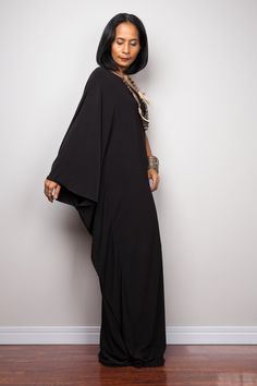 "Black one shoulder dress, Long black kaftan dress, Off shoulder evening dress, black cocktail dress, black party dress, reversible dress PRODUCT SIZE : Free Size * Chest : 40\" will stretch to 44\" * Waist : 40\" will stretch to 44\" * Hips : 40\" will stretch to 44\" * Sleeve length : 23\" * Length : 57\" - 58\" from shoulder to hem (measured when laying flat) MATERIAL : * ITY (polyester jersey) > soft and comfortable to wear, not as slippery as spandex. NOTE : * Model chest : 32\", waist : Black Maxi Dress With Side Slits, Black Floor-length Abaya For Party, Evening Maxi Dress With Batwing Sleeves, Black One-shoulder Dress With Side Slits For Night Out, Black Bohemian Maxi Dress For Night Out, Black Evening Dress With Batwing Sleeves, Black Batwing Sleeve Evening Dress, Chic Black One Shoulder Dress With Side Slits, Black One-shoulder Dress With Side Slits