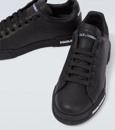 Find DOLCE & GABBANA Logo Leather Sneakers on Editorialist. Lining: leather. Sole: leather insole, rubber sole. Toe shape: round toe. Upper: leather. Closure: lace-up. Designer color name: Black/Black. Comes with a box. Made in Italy. Comes with dust bag. Black Sneakers With Vulcanized Sole In Calf Leather, Black Calf Leather Sneakers With Vulcanized Sole, Sneakers With Leather Sole And Round Toe, Black Leather Shoes With Rubber Sole In Calf Leather, Leather Sole Sneakers With Round Toe And Medium Fit, Black Low-top Leather Shoes With Rubber Sole, Designer Sneakers With Stitched Sole And Round Toe, Designer Leather Sneakers With Rubber Sole, Black Leather Shoes With Rubber Sole For Streetwear