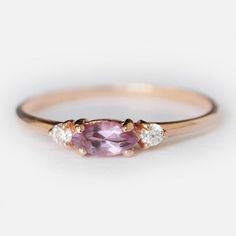 Engagement Ring Details14k Solid Rose Gold (Also available in White and Yellow Gold, Please select at checkout) 1.5mm (Approximate Band Width) Amethyst (Center Stone) Marquise 6X3mm (Center Stone Dimensions) 0.22 Carats (Average Center Stone Weight)Surrounding Diamond DetailsWhite Diamonds 0.06 Carats (Total Diamond Weight/ 2 Pcs.) SI-H (White Diamond) Brilliant CutRing can be resized from 3-10, Metal can be made in 14, 18K/ White, Yellow and Rose Gold.For custom order this ring with a different Dainty Amethyst Ring With Accent Stones, Purple Rose Cut Diamond Rings In 14k Gold, Purple 14k Gold Ring With Rose Cut Diamonds, Purple 14k Gold Rings With Rose Cut Diamonds, Purple Diamond Ring With Rose Cut For Gift, Fine Jewelry Amethyst Promise Ring With Rose Cut Diamonds, Gift Purple Sapphire Ring With Rose Cut Diamonds, Purple Sapphire Ring With Rose Cut Diamonds As Gift, Purple Pink Sapphire Promise Ring