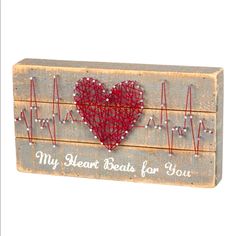 a wooden sign with a heart on it that says, my heart beats for you