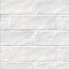 a white brick wall is shown in this image